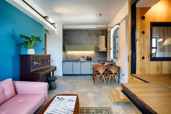 kitchen and living room with bleu wall and pink sofa contemporary decor mid-century style