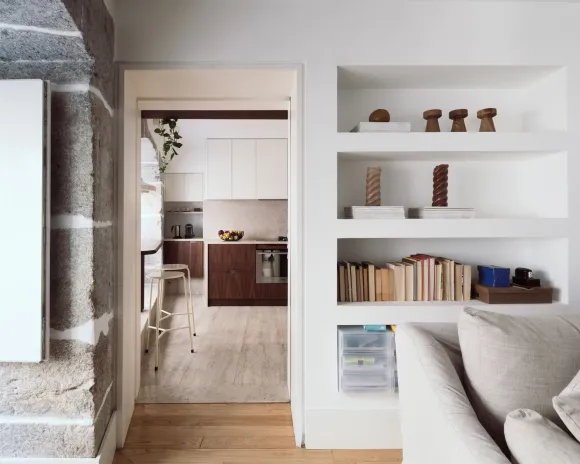 kitchen and living room with arched stoned windows designer decor apartment in Lisbon