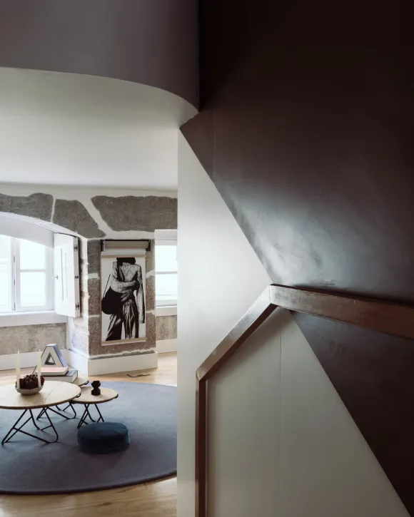 living room with arched stoned windows designer decor period apartment in Lisbon