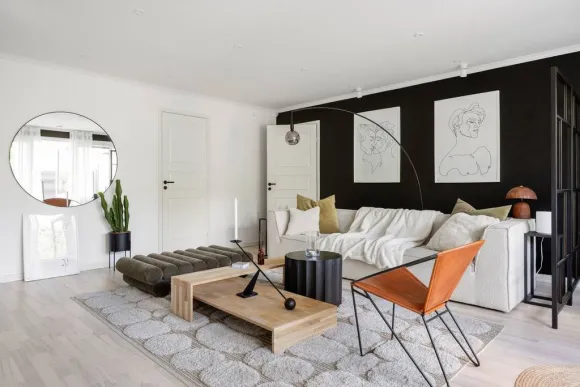 salon mur noir décoration design et scandinave appartement deux-pièces 68m2