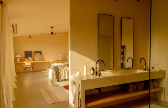bedroom with bathroom Casa Carolina house in Emporda Spain with pool rustic chic decor