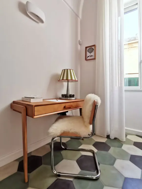 desk and green terracotta tiles