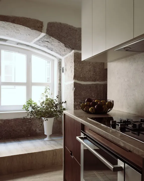walnut kitchen with arched stoned windows 